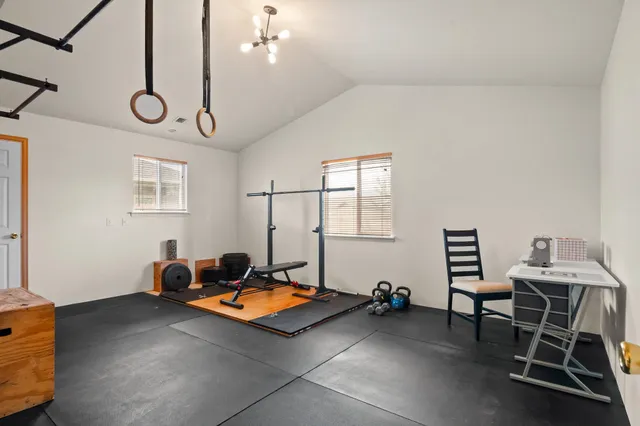 a room with gym equipment and a window