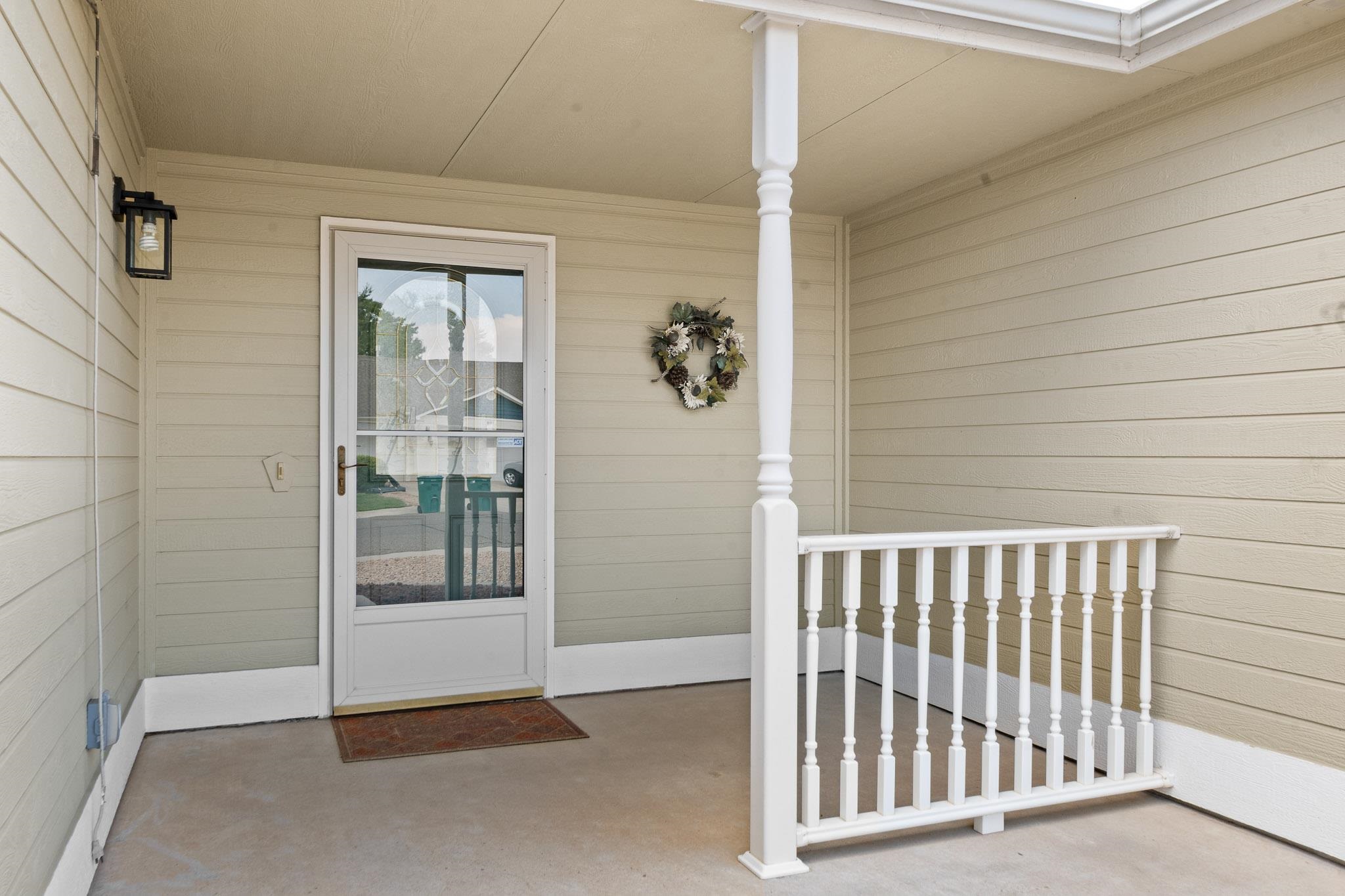 912 Kaley Street Fruita, CO 81521 - Photo 7 of 32 a view of a porch with a door