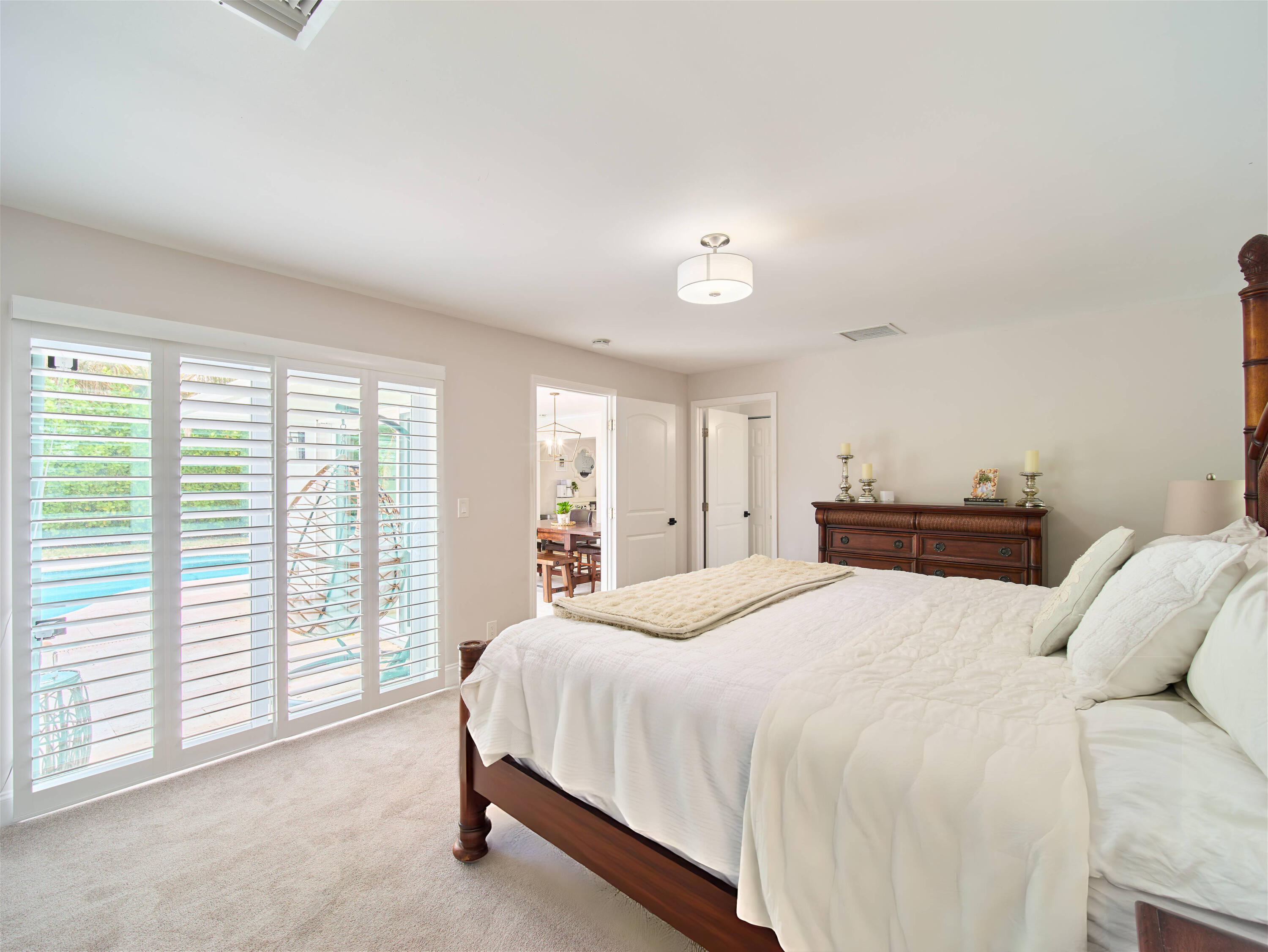 359 Church Road Tequesta, FL 33469 - Photo 11 of 30 a spacious bedroom with a bed and a window