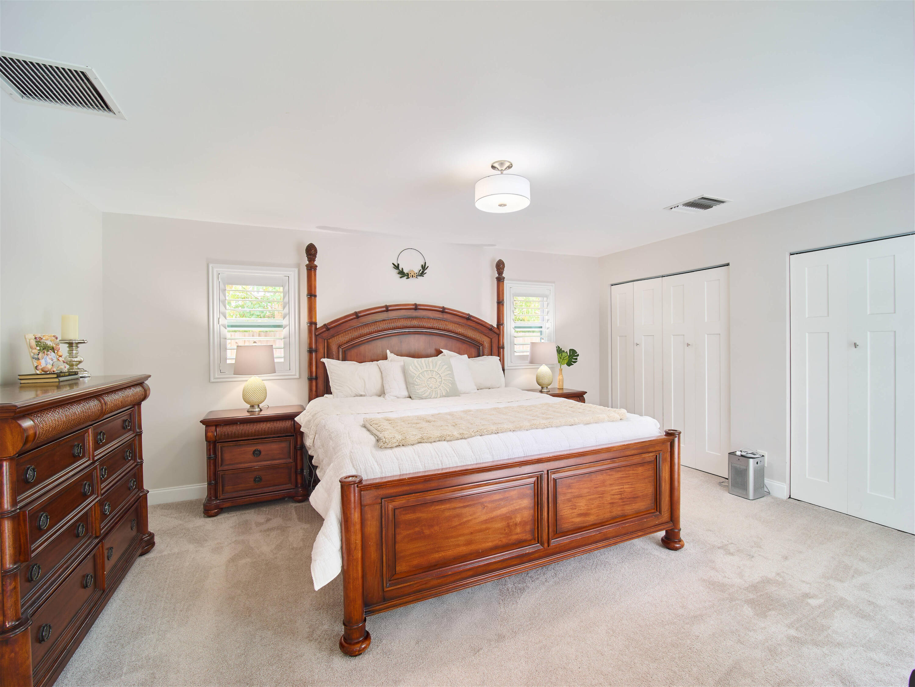 359 Church Road Tequesta, FL 33469 - Photo 12 of 30 a bedroom with a bed and a dresser