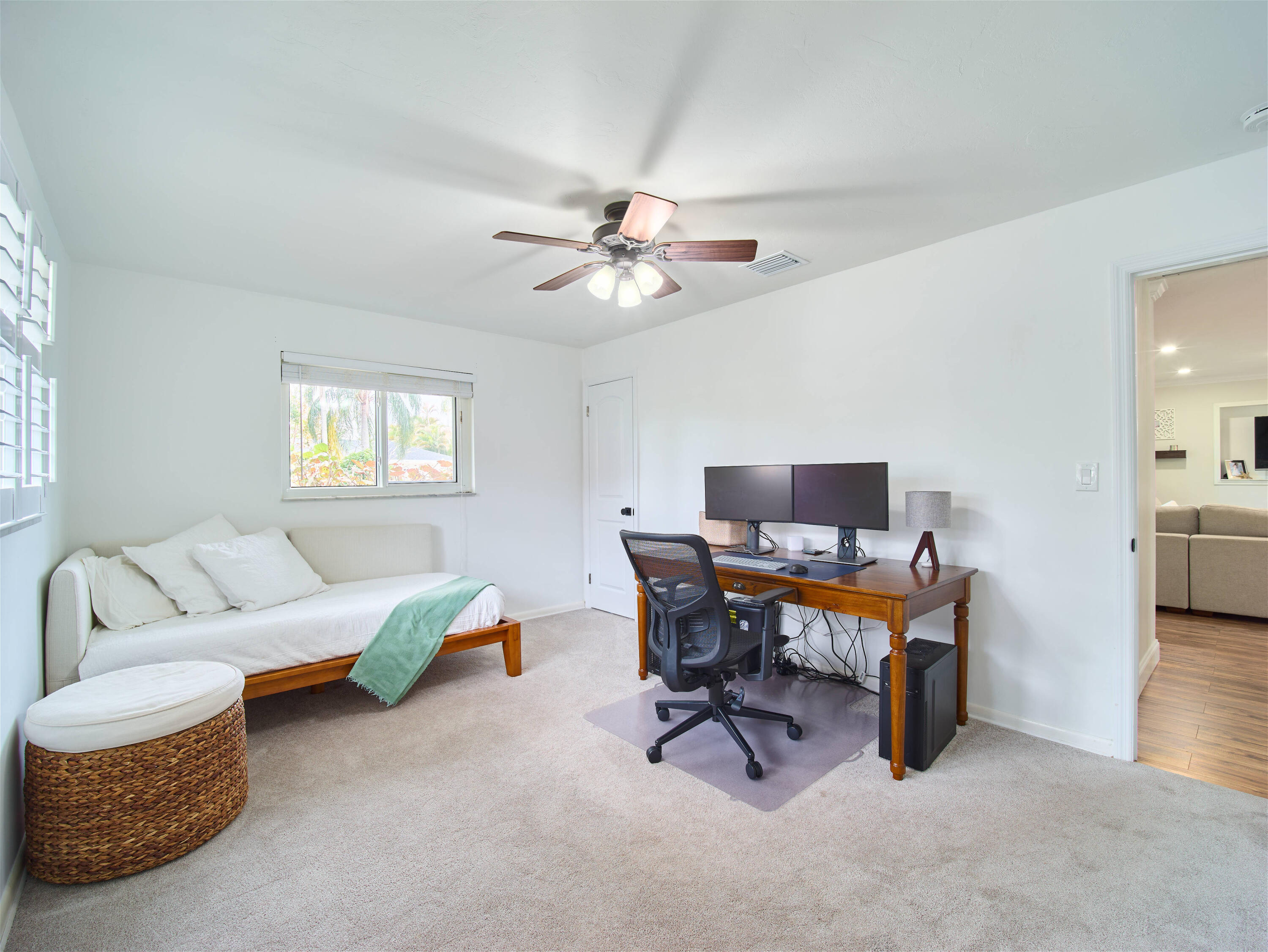 359 Church Road Tequesta, FL 33469 - Photo 14 of 30 a living room with furniture and a chandelier