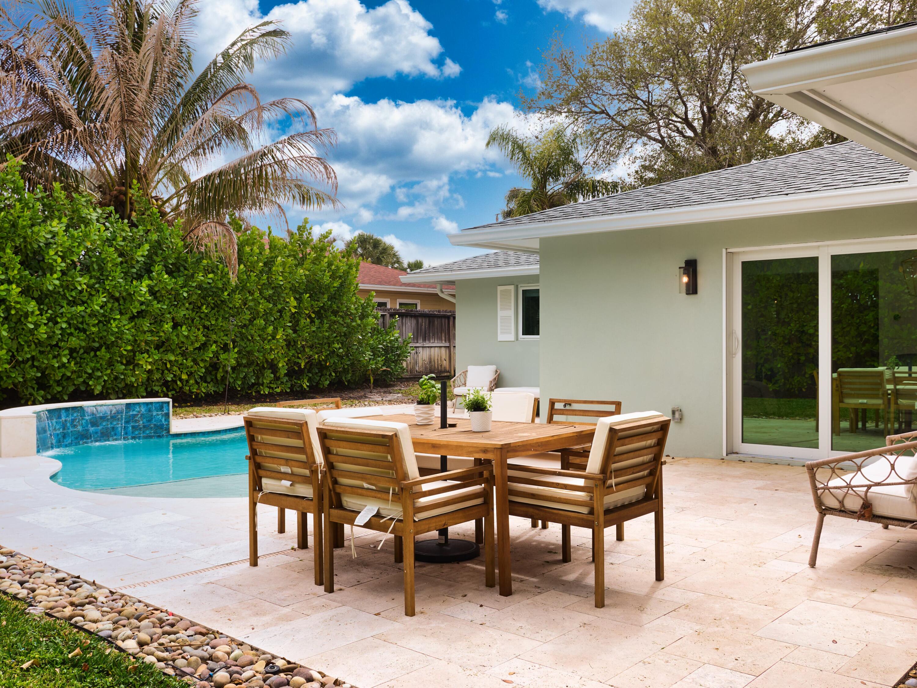 359 Church Road Tequesta, FL 33469 - Photo 21 of 30 a view of a patio with a backyard