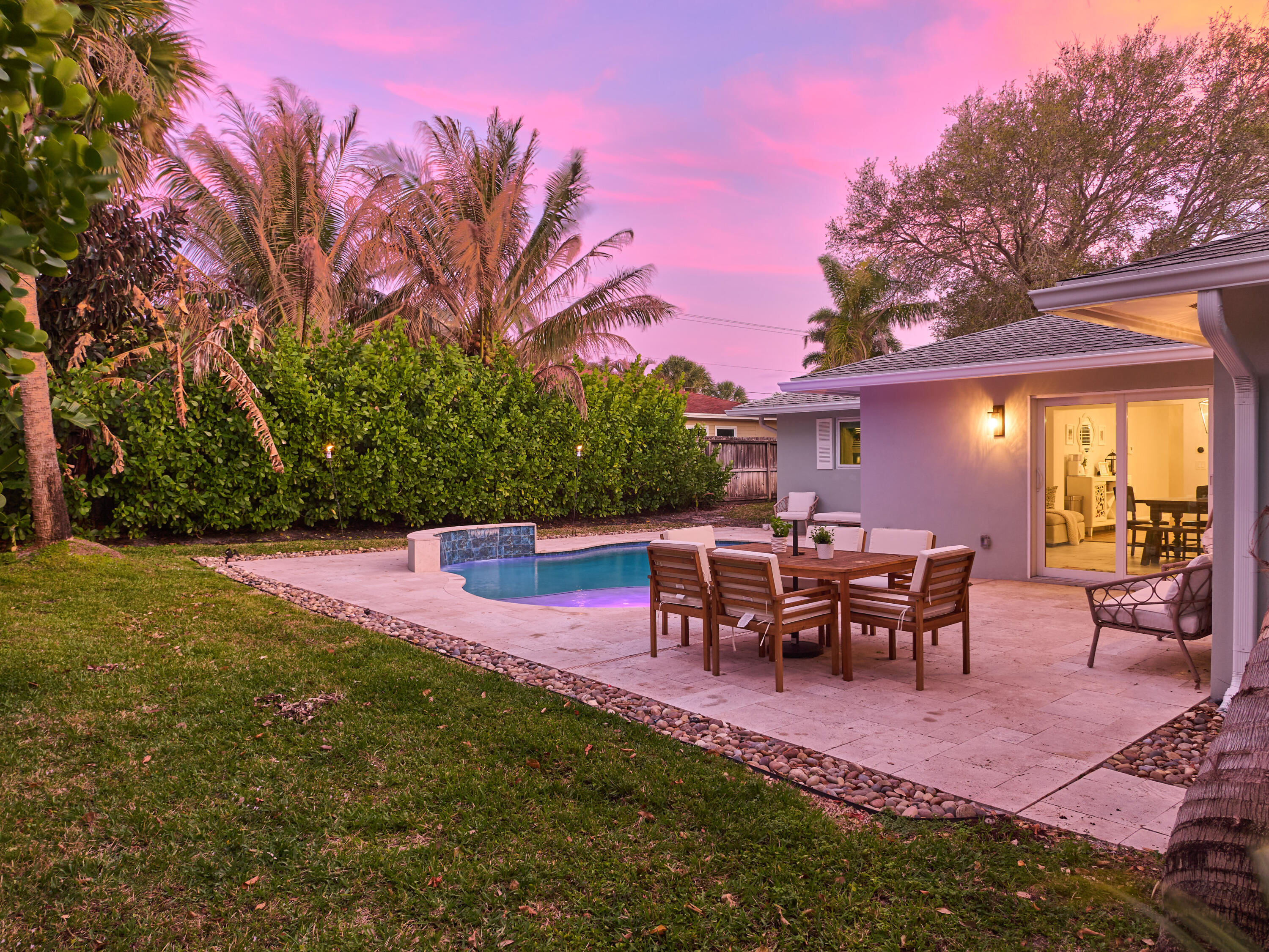 359 Church Road Tequesta, FL 33469 - Photo 27 of 30 a view of a backyard with table and chairs