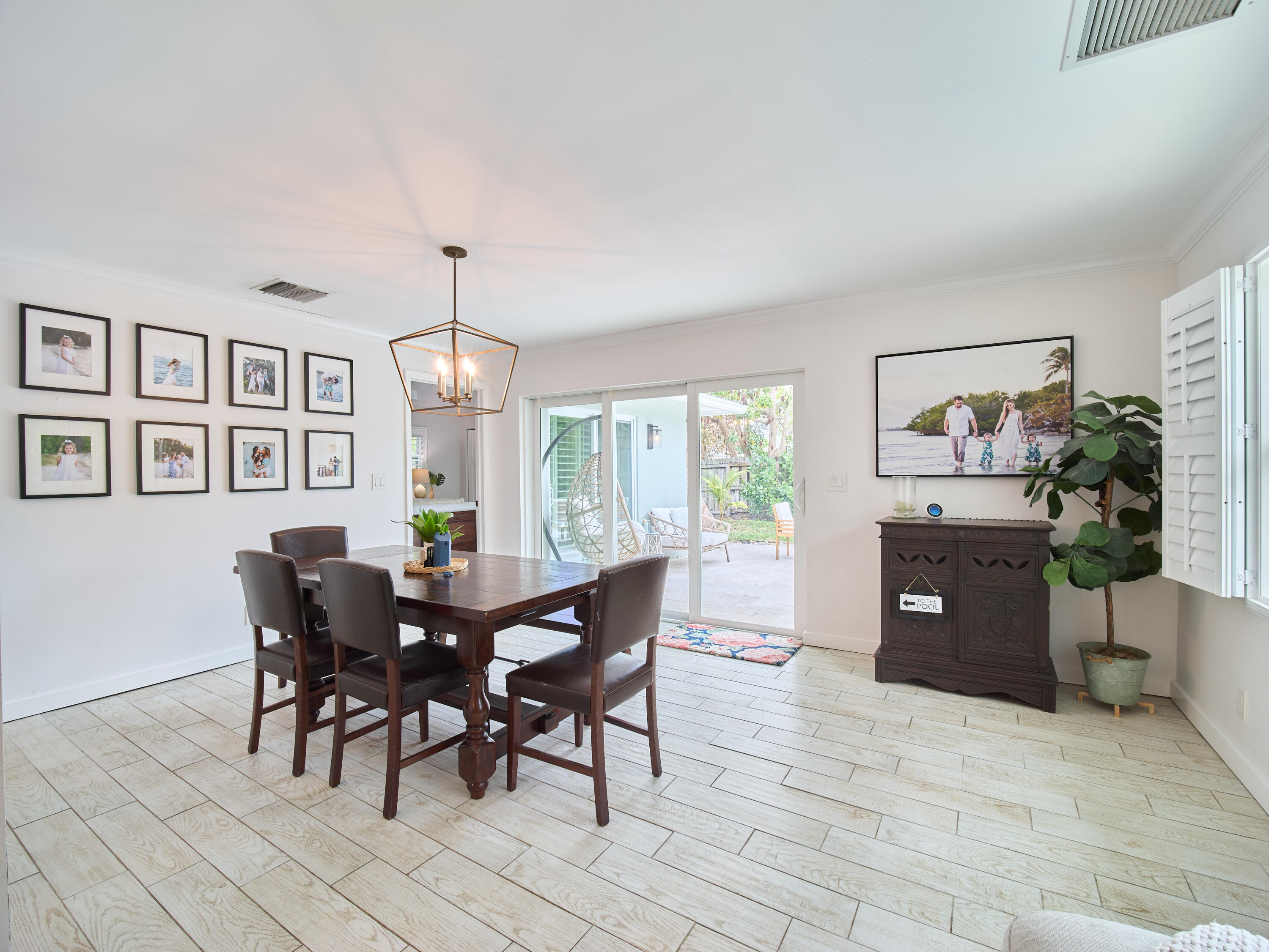 359 Church Road Tequesta, FL 33469 - Photo 5 of 30 a view of a dining room with furniture window and wooden floor