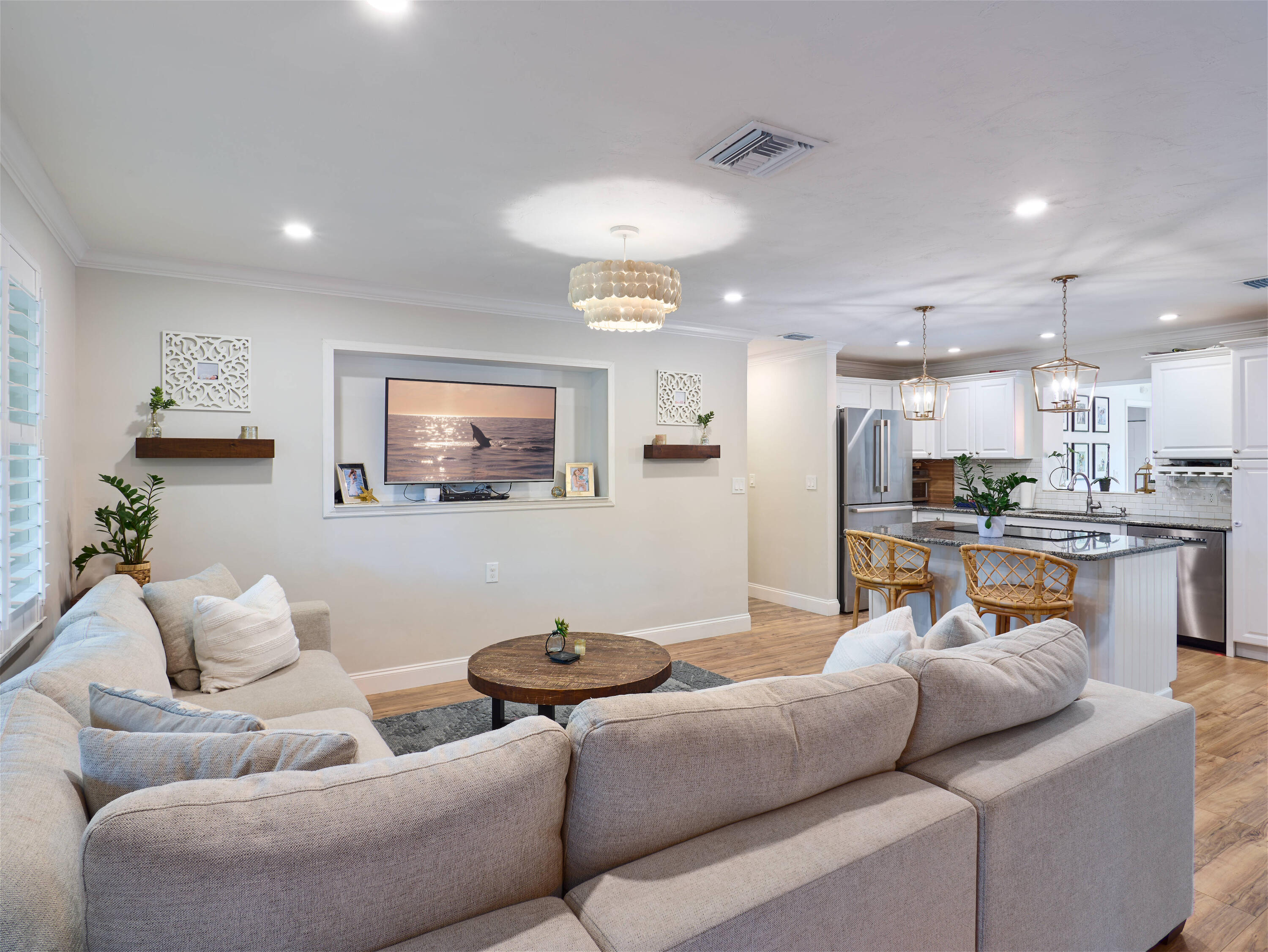 359 Church Road Tequesta, FL 33469 - Photo 9 of 30 a living room with furniture and a view of kitchen