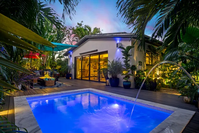 a view of swimming pool with sitting area
