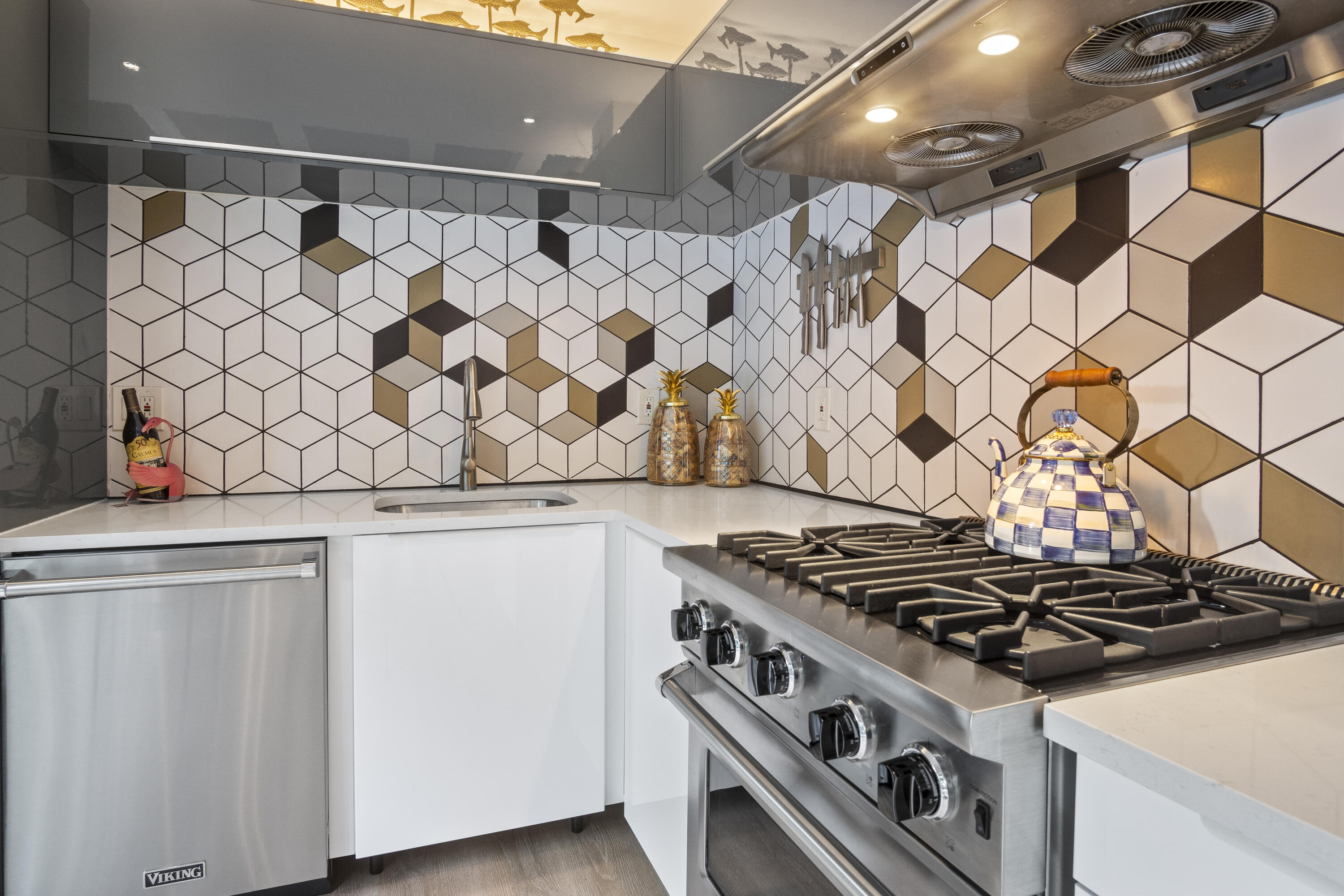1616 Bertha Street, Unit 2 Key West, FL 33040 - Photo 11 of 45 a white stove top oven sitting inside of a kitchen
