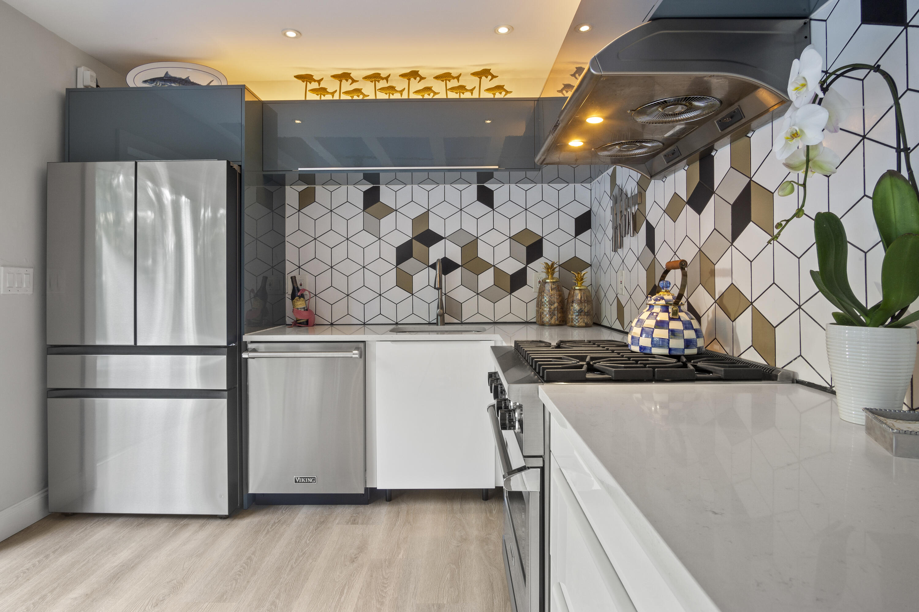 1616 Bertha Street, Unit 2 Key West, FL 33040 - Photo 18 of 45 a kitchen with stainless steel appliances granite countertop a refrigerator and a stove