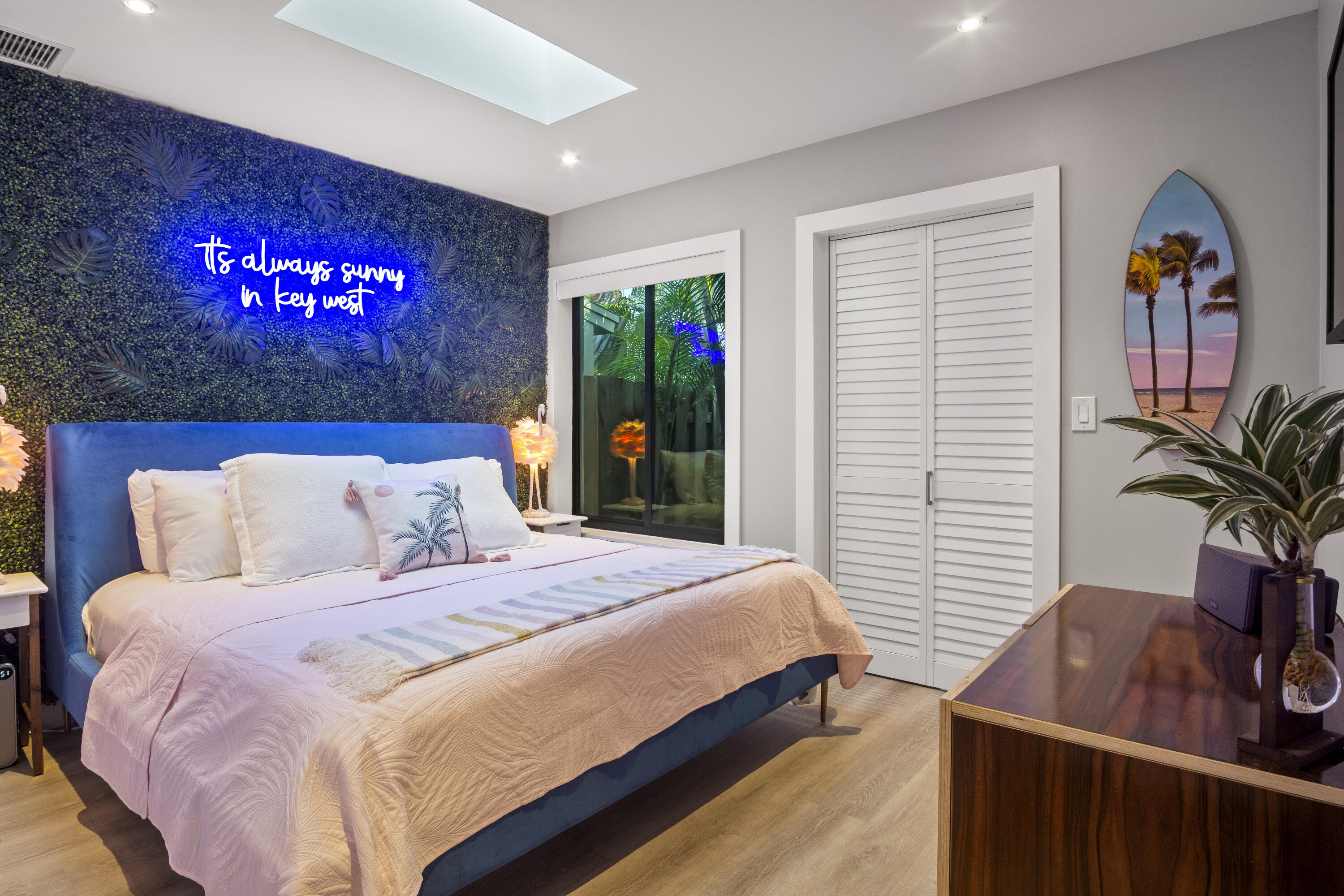 1616 Bertha Street, Unit 2 Key West, FL 33040 - Photo 20 of 45 a bedroom with a bed and a potted plant