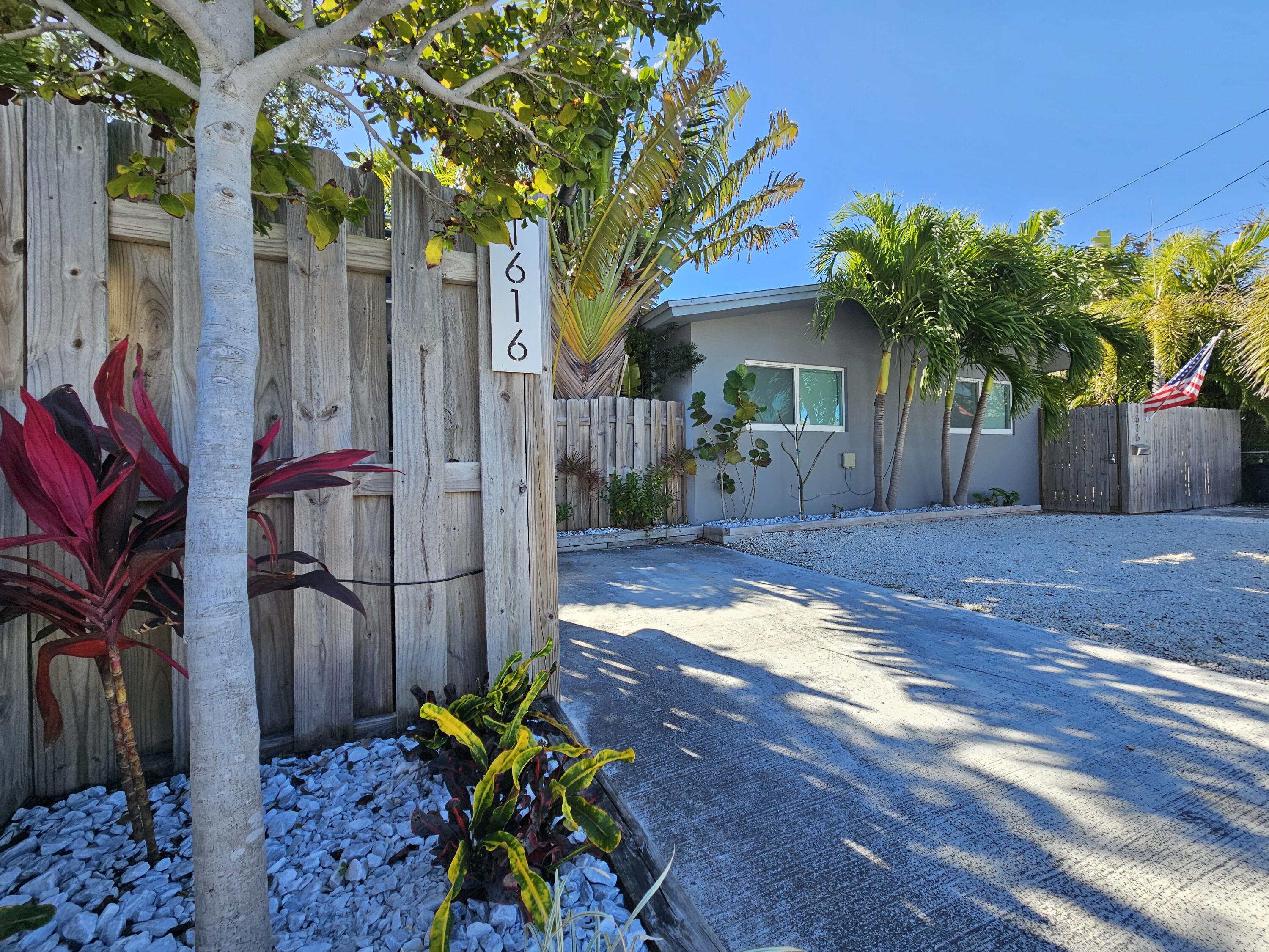 1616 Bertha Street, Unit 2 Key West, FL 33040 - Photo 43 of 45 a view of a backyard with potted plants