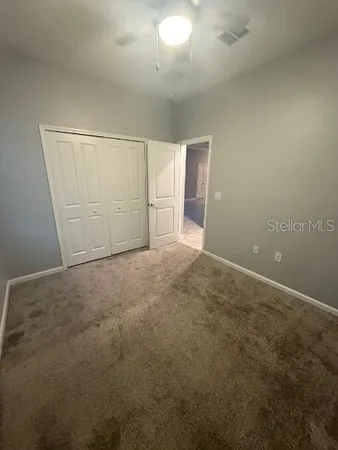 an empty room with a empty space and windows