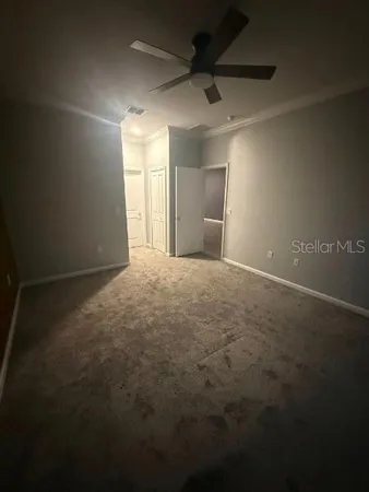 a view of an empty room with a window