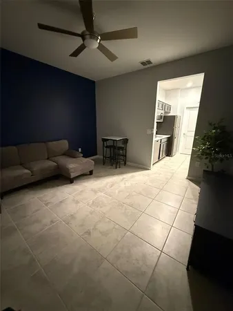 a kitchen with a sink a stove and cabinets