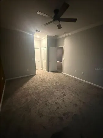 a view of an empty room with a window