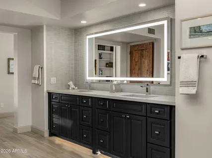 a bathroom with a bathtub and shower