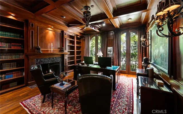 a living room with fireplace furniture and a flat screen tv