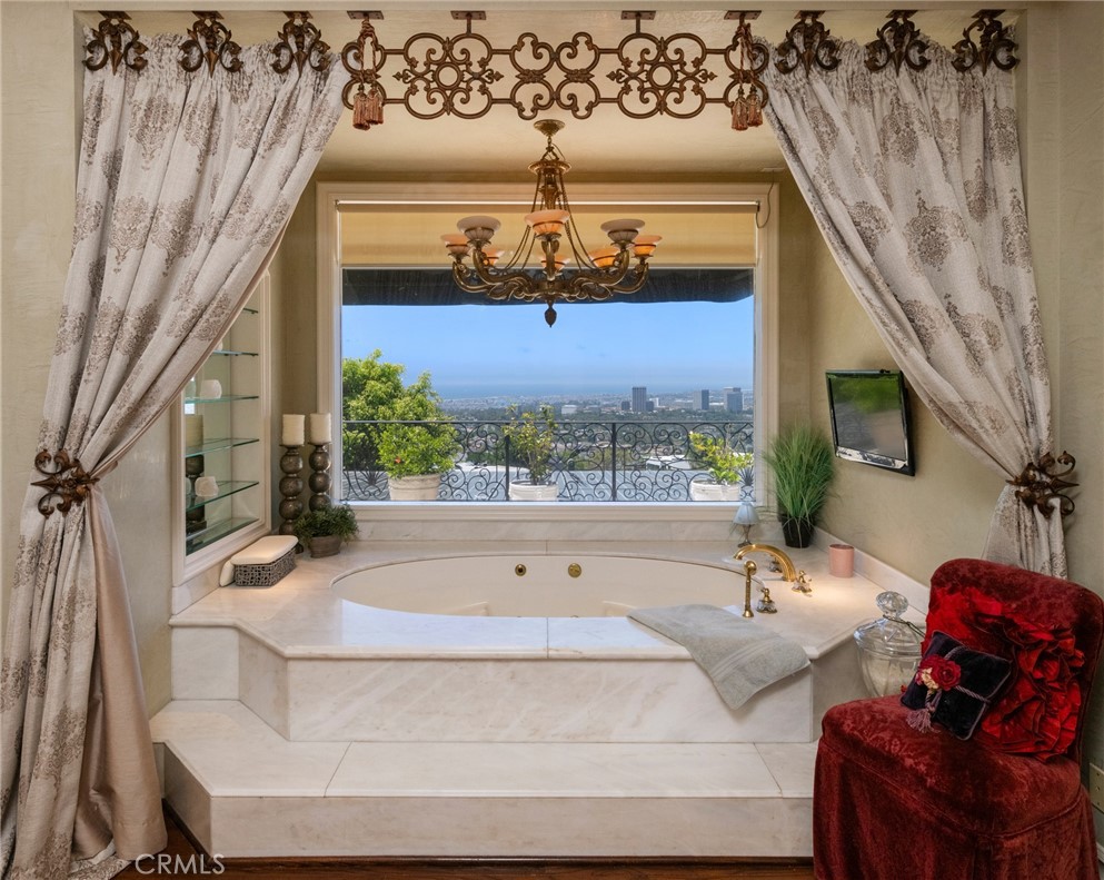 5 Ridgeline Drive Newport Beach, CA 92660 - Photo 15 of 16 a living room with furniture and a chandelier