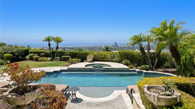 a view of a swimming pool and lounge chair