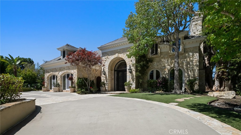 5 Ridgeline Drive Newport Beach, CA 92660 - Photo 4 of 16 front view of a building with a street