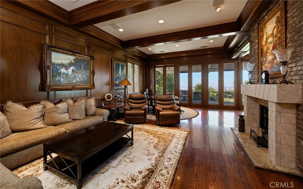 5 Ridgeline Drive Newport Beach, CA 92660 - Photo 10 of 16 a living room with furniture and a fireplace