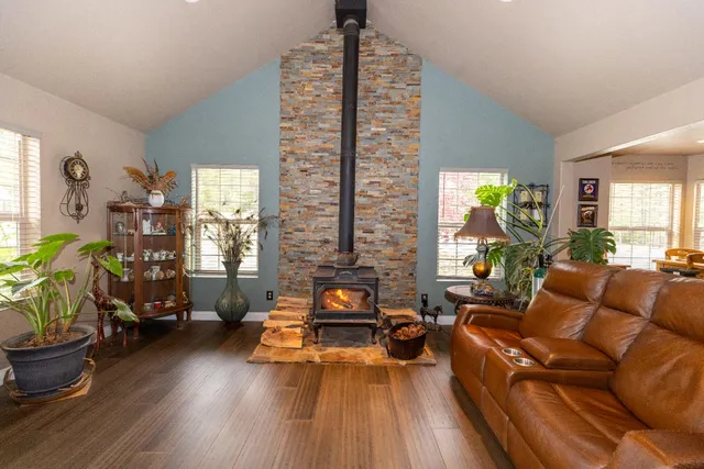 a view of a yard with wooden fence