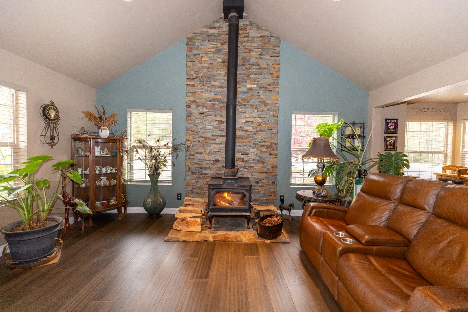 10070 Swiss Ranch Road Mountain Ranch, CA 95246 - Photo 11 of 64 a living room with furniture hard wood floor and a floor to ceiling window