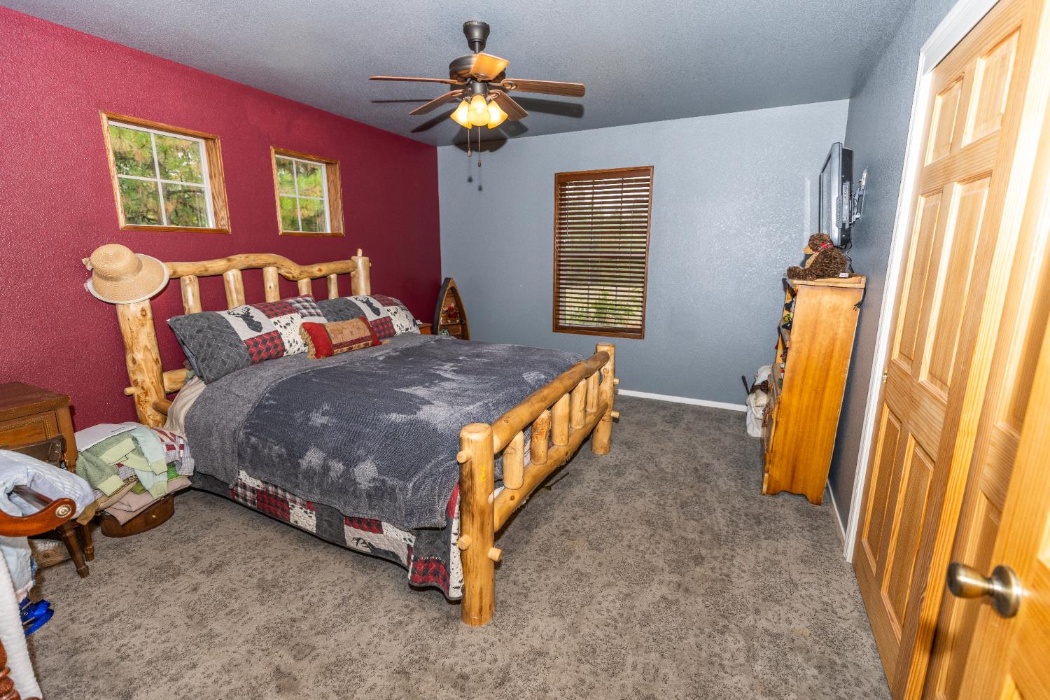 10070 Swiss Ranch Road Mountain Ranch, CA 95246 - Photo 17 of 64 a bedroom with a bed and a window