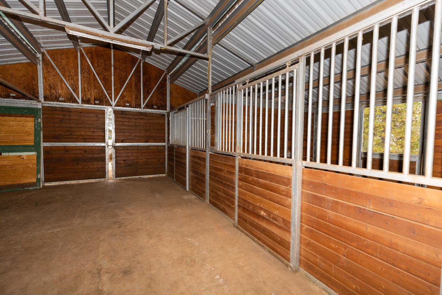 10070 Swiss Ranch Road Mountain Ranch, CA 95246 - Photo 58 of 64 a view of an empty room with wooden floor