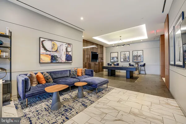 a living room with furniture and a rug