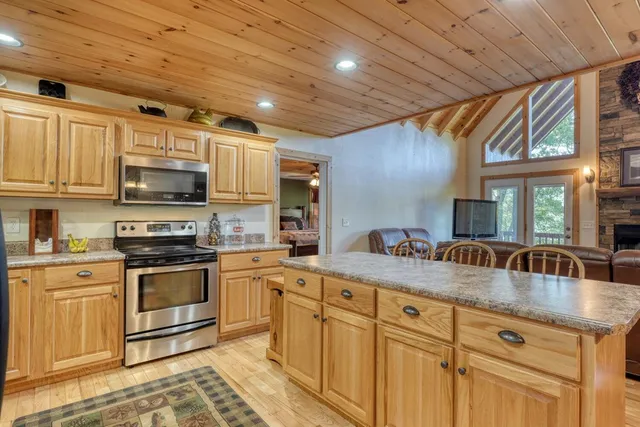 a kitchen with sink and natural light