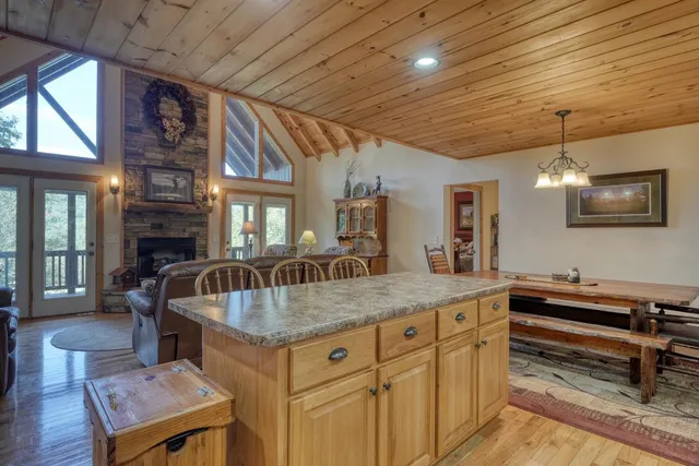 a kitchen with sink stove and refrigerator