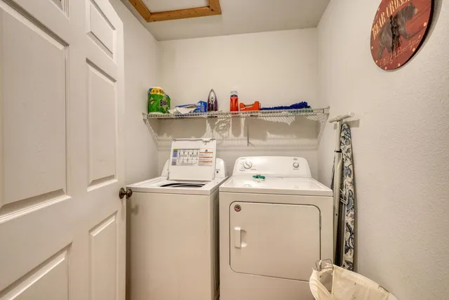 a living room with furniture a fireplace and a floor to ceiling window