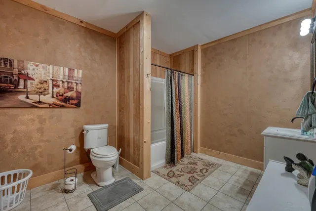 a bathroom with a sink vanity and mirror