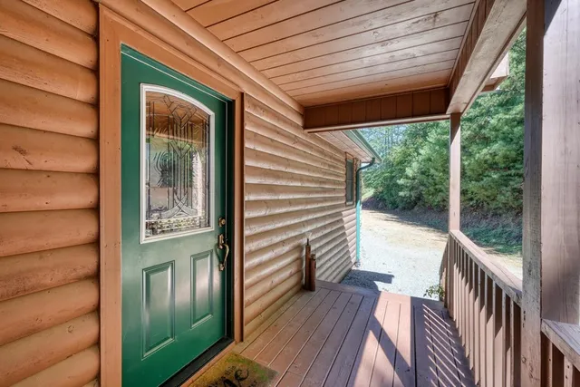 a view of front door with wooden door