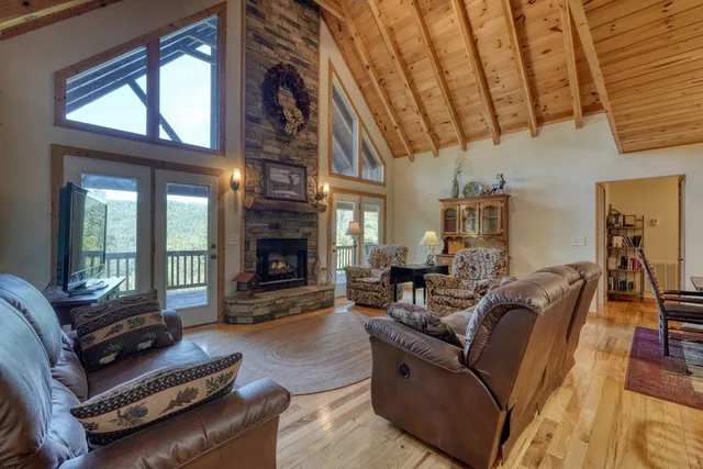 a living room with furniture fireplace and flat screen tv