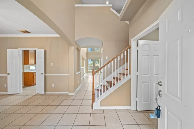 a view of an entryway with wooden floor