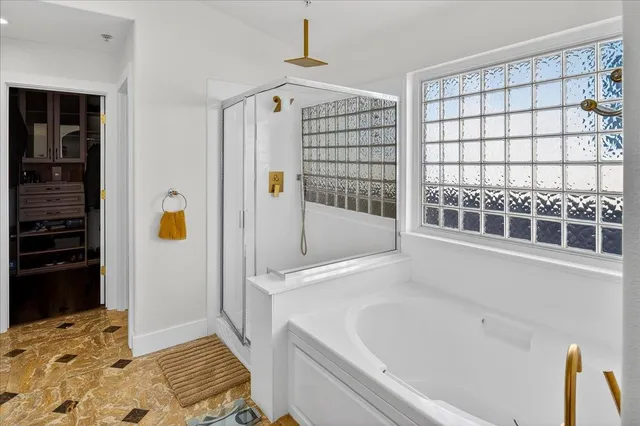 a living room with furniture flowerpot and wooden floor