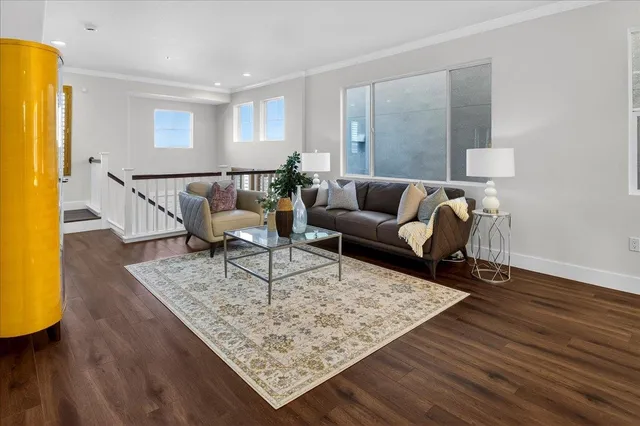 a dining room with furniture and wooden floor
