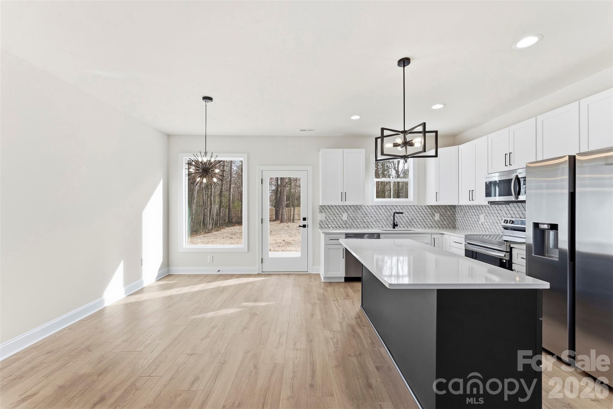 1724 Barnhardt Road China Grove, NC 28023 - Photo 11 of 46 a large kitchen with lots of counter space a sink appliances and cabinets