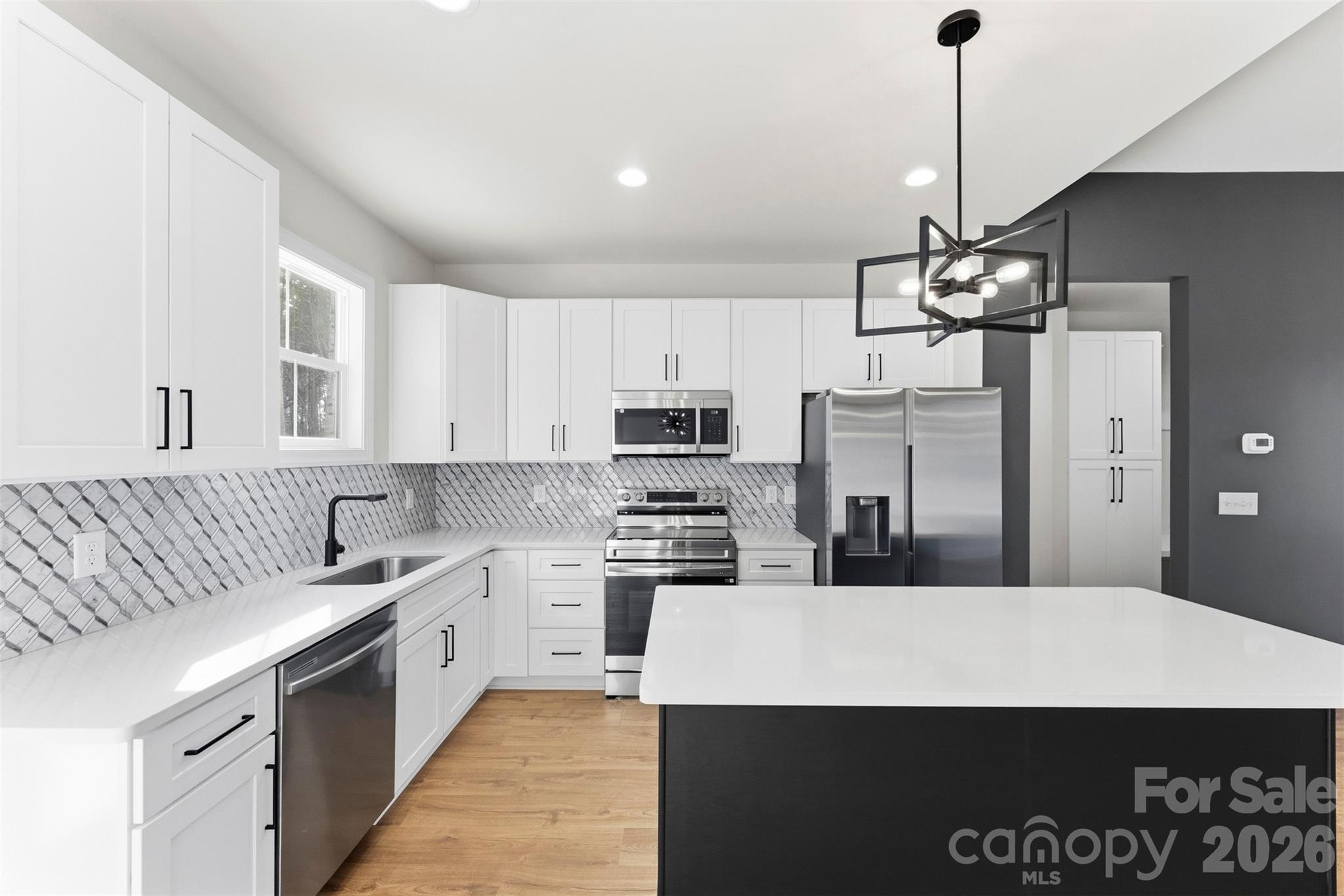 1724 Barnhardt Road China Grove, NC 28023 - Photo 15 of 46 a kitchen with kitchen island a sink stainless steel appliances and cabinets
