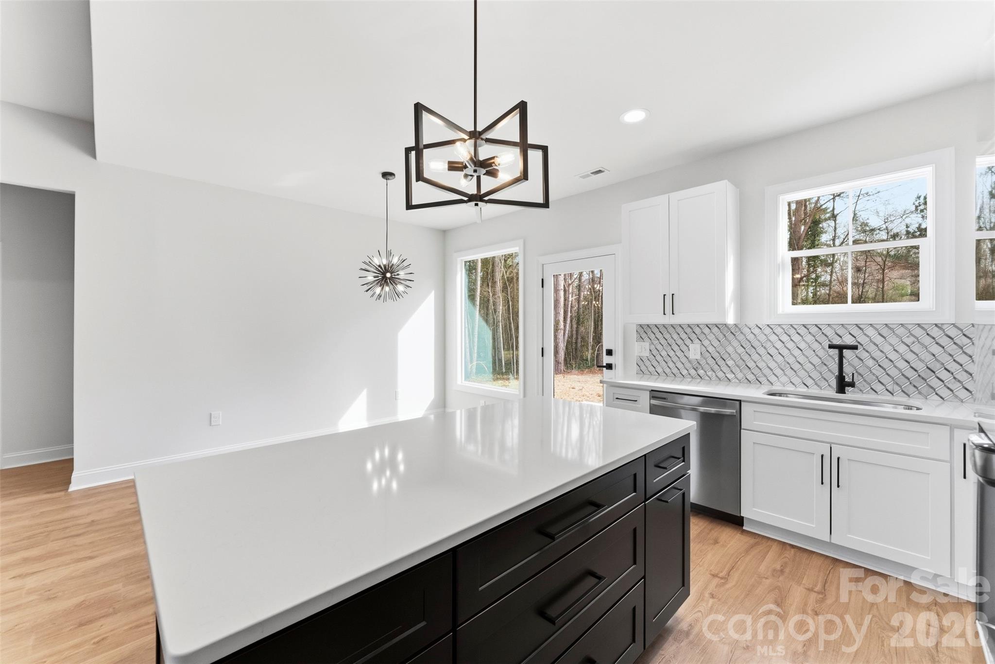 1724 Barnhardt Road China Grove, NC 28023 - Photo 18 of 46 a view of a kitchen with a sink stainless steel appliances and a window