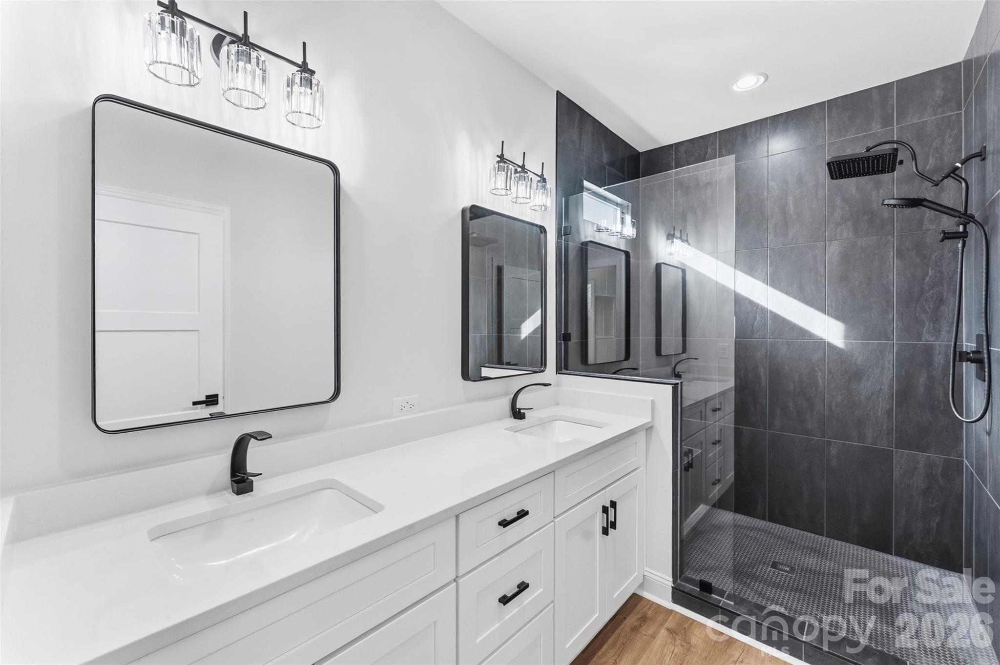 1724 Barnhardt Road China Grove, NC 28023 - Photo 23 of 46 a bathroom with double vanity sink and a mirror