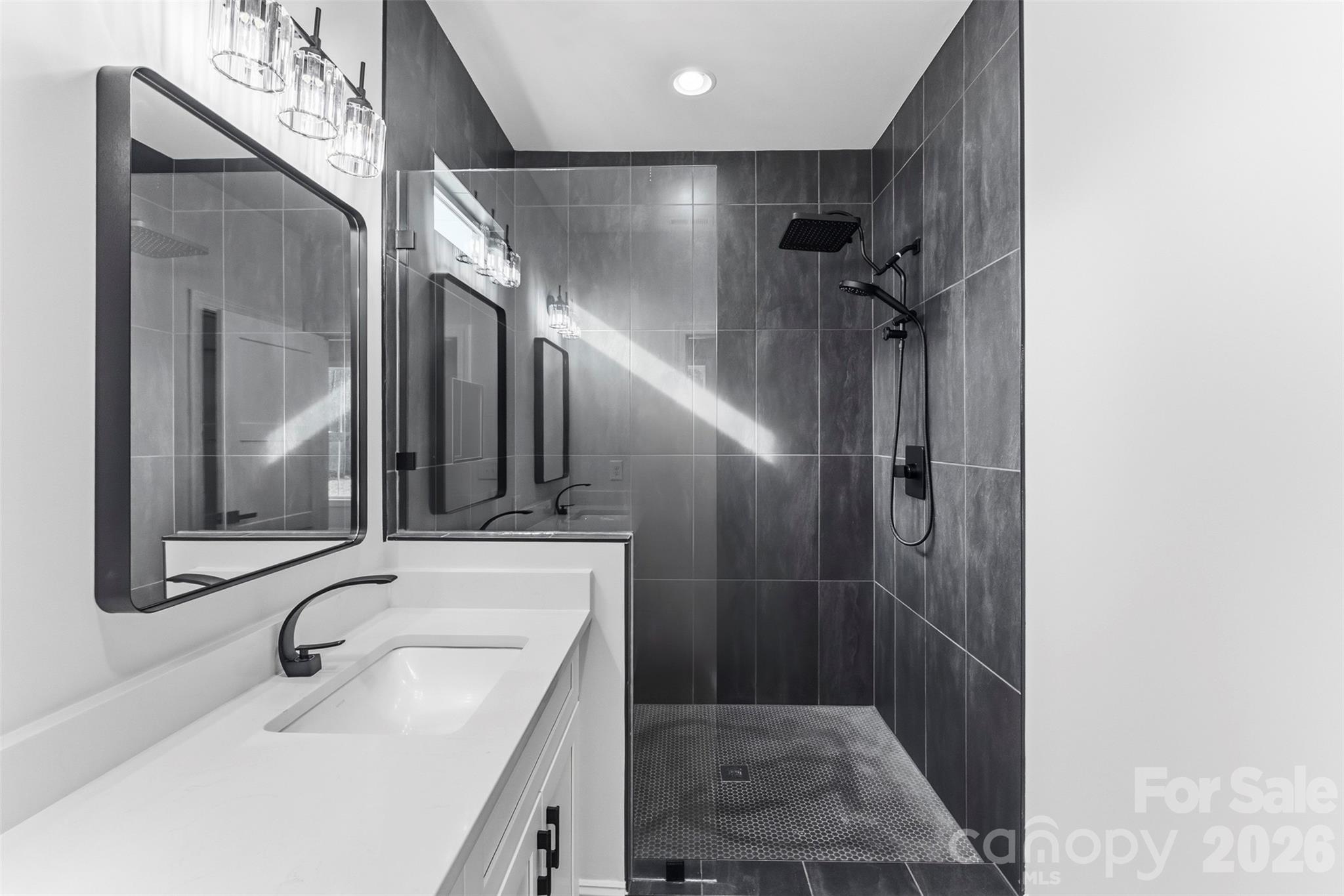 1724 Barnhardt Road China Grove, NC 28023 - Photo 24 of 46 a bathroom with a sink a toilet a mirror and shower