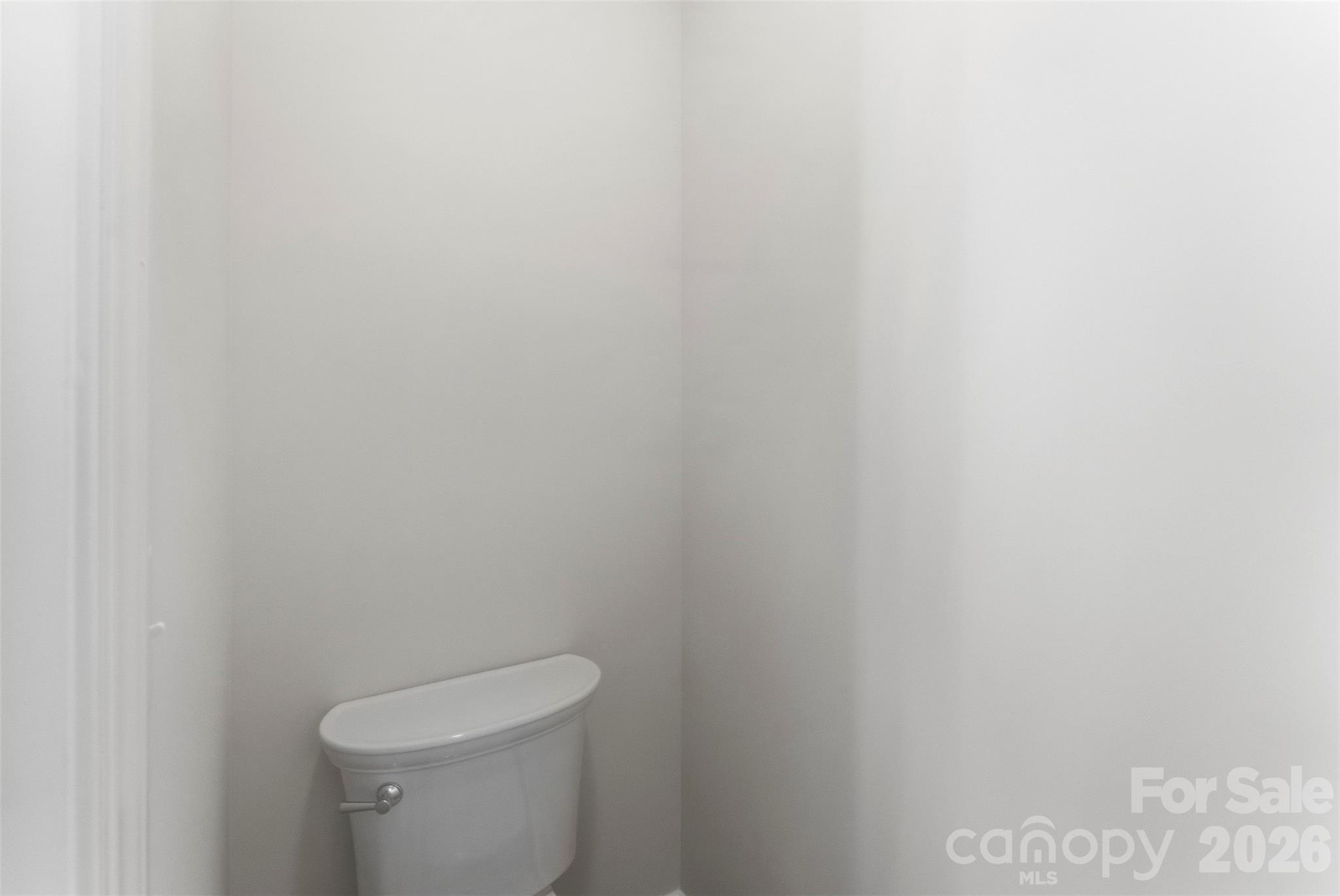 1724 Barnhardt Road China Grove, NC 28023 - Photo 25 of 46 a white toilet sitting next to a white cabinet