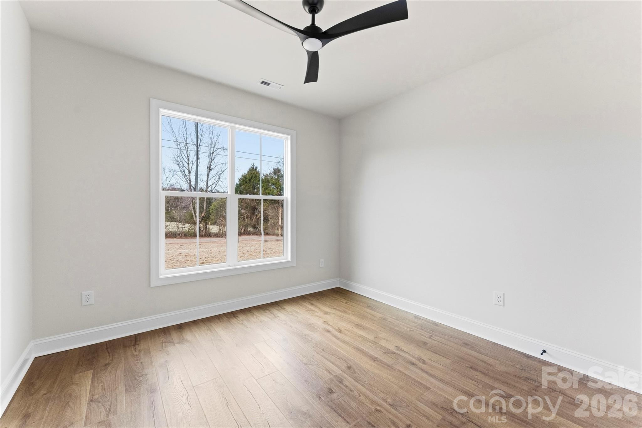 1724 Barnhardt Road China Grove, NC 28023 - Photo 28 of 46 an empty room with wooden floor and windows