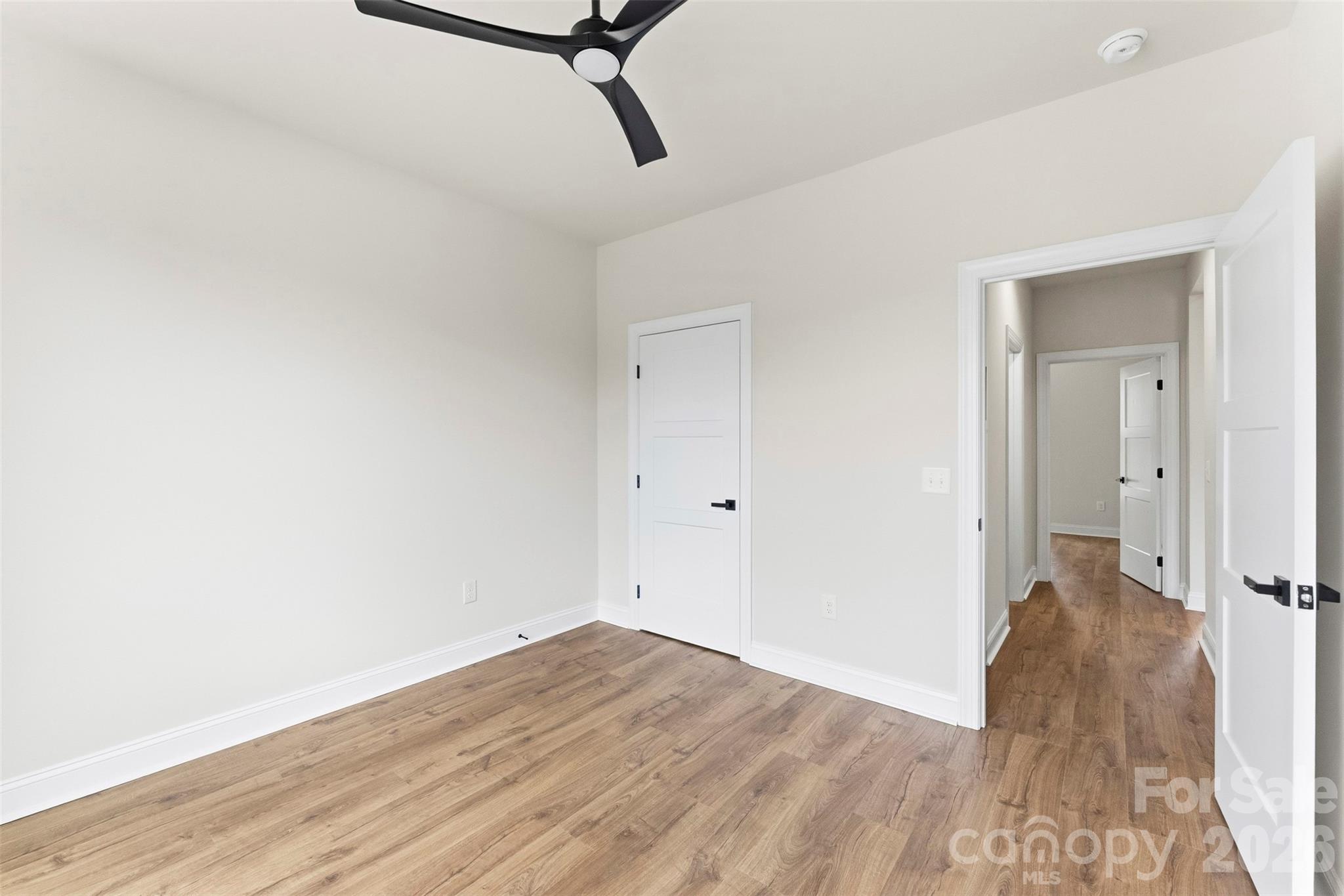 1724 Barnhardt Road China Grove, NC 28023 - Photo 30 of 46 a view of a room with wooden floor staircase and a ceiling fan