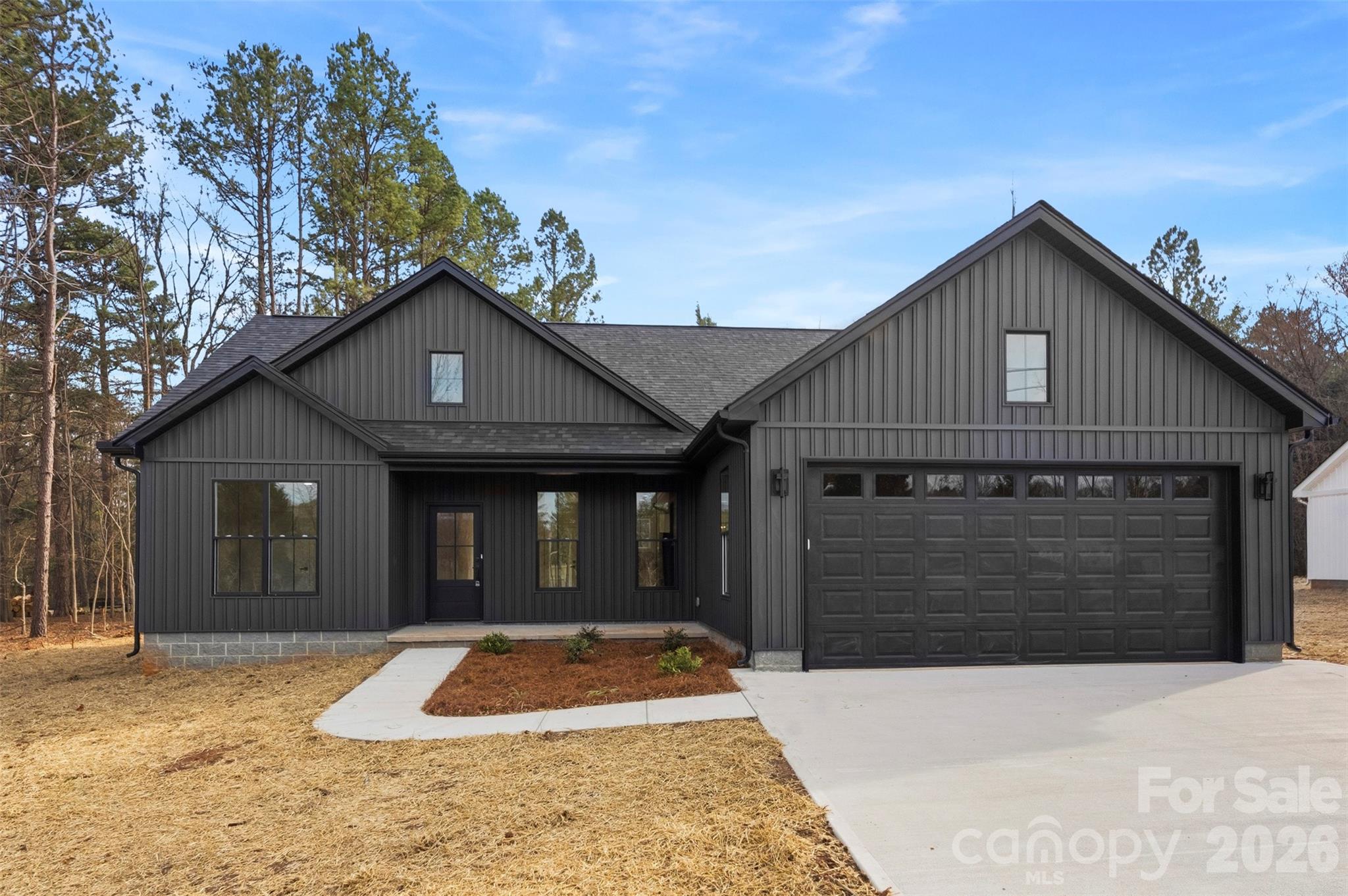 1724 Barnhardt Road China Grove, NC 28023 - Photo 4 of 46 a front view of a house with a yard