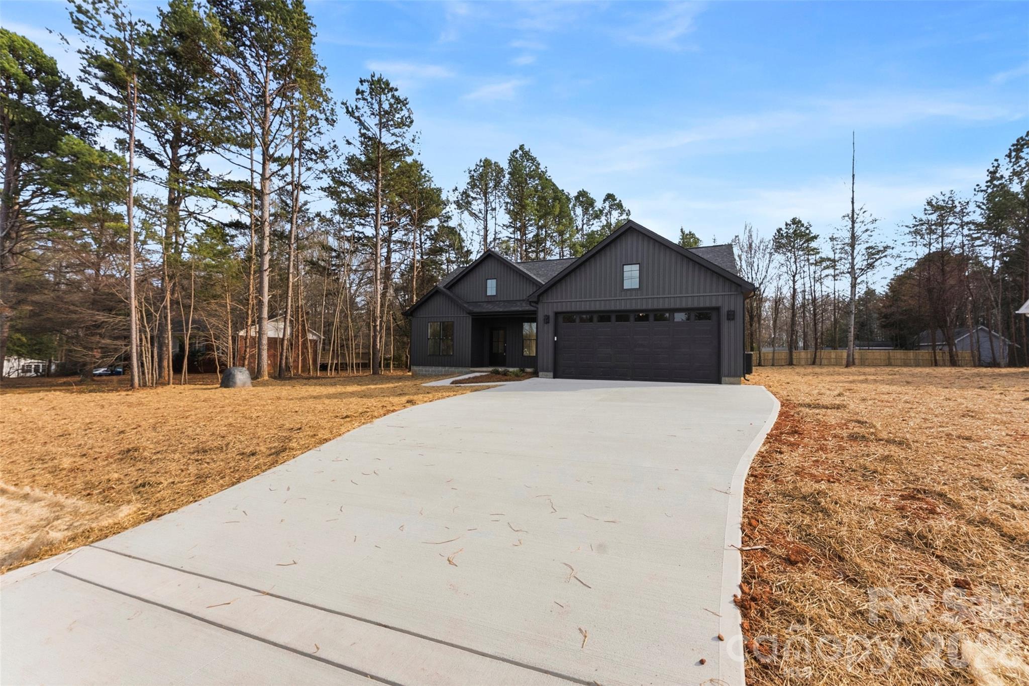 1724 Barnhardt Road China Grove, NC 28023 - Photo 43 of 46 a front view of a house with a yard covered with snow
