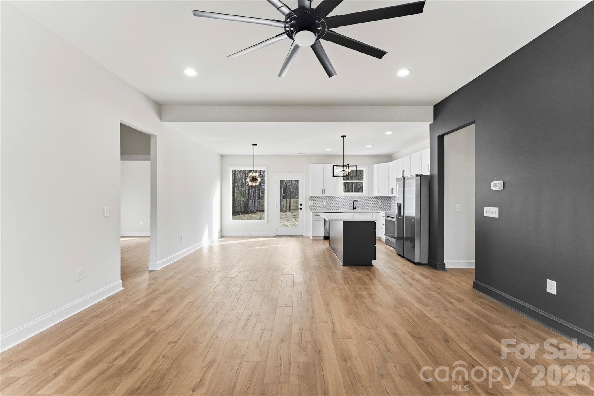 1724 Barnhardt Road China Grove, NC 28023 - Photo 6 of 46 a view of a kitchen with a sink and dishwasher a refrigerator with wooden floor