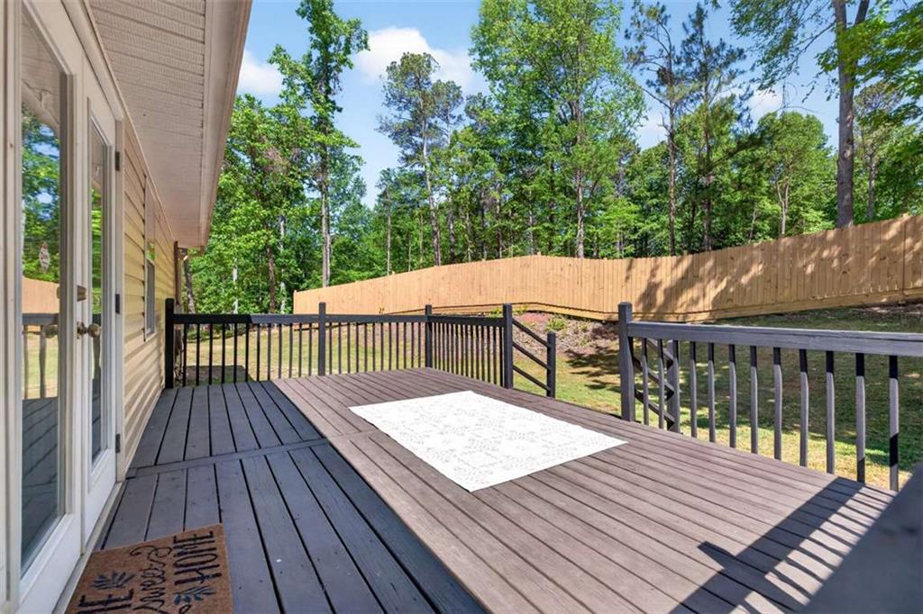 386 Ridgewood Drive Pendergrass, GA 30567 - Photo 42 of 50 a view of balcony with wooden floor and fence